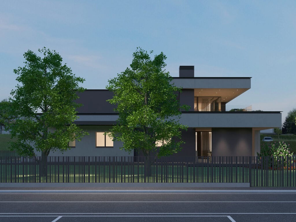 Esterno serale della residenza unifamiliare a Treviso con volumi a sbalzo e giardino illuminato